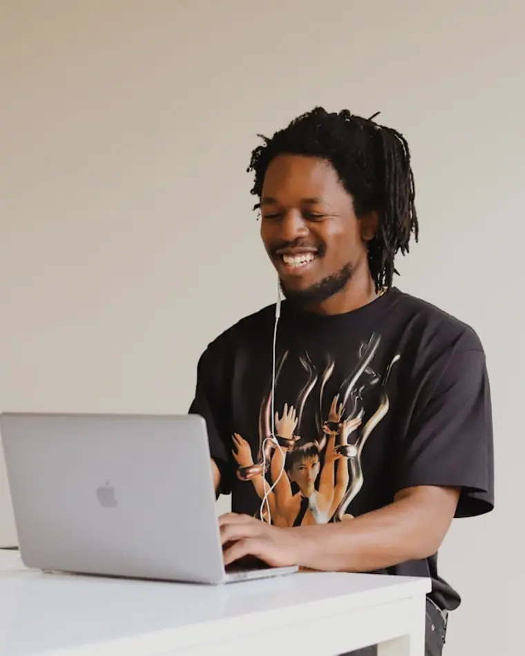 A learner working through a lesson on a laptop.