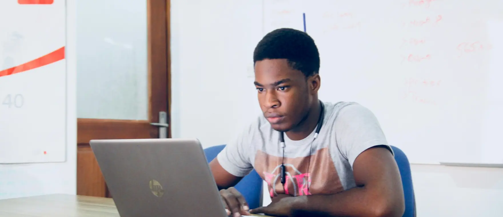 A student reviewing lesson material on a laptop.