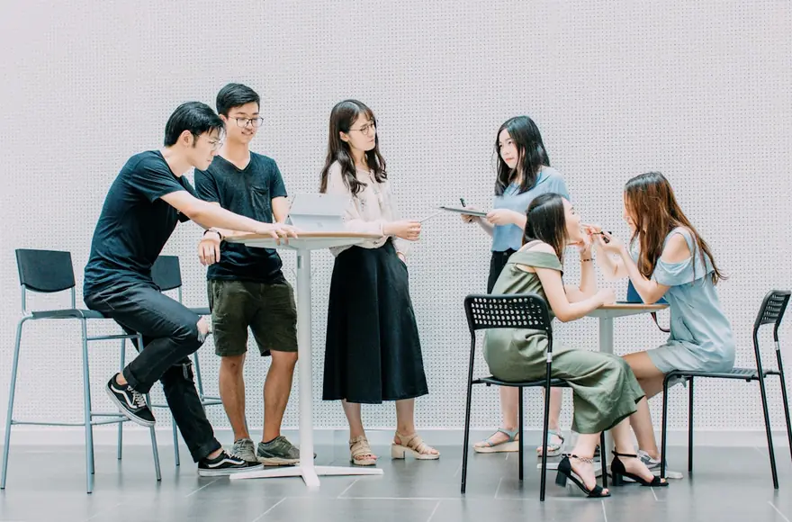 A team planning together around a table.