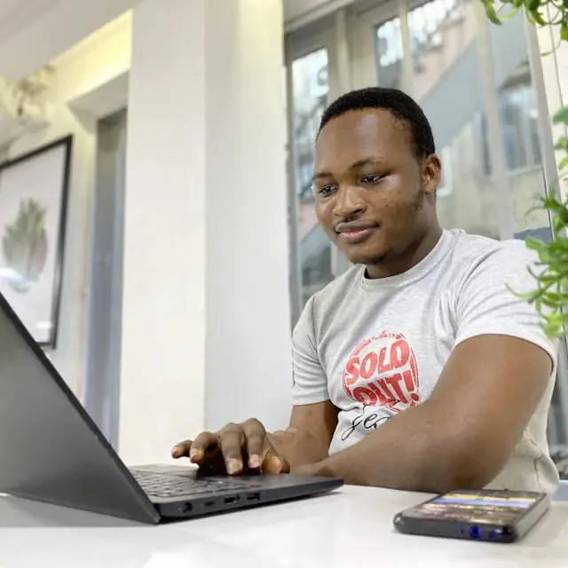 A learner working through a lesson on a laptop.